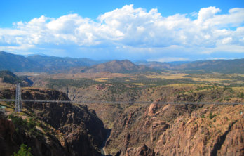 Royal Gorge Bridge in the distance over the gorge on a bright blue sunny day near Happy Acres RV Park Pueblo CO